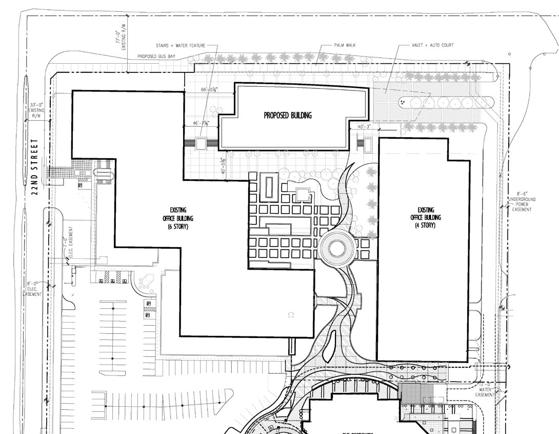 Anchor Center site plan drawing showing the proposed building, two existing office buildings, courtyard, drive aisles, and surface parking layout