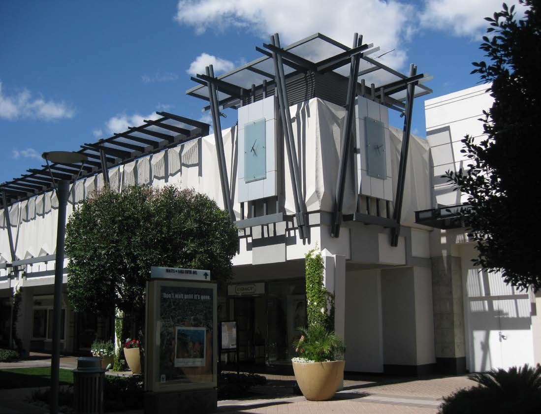 Redesigned steel shade structure at Biltmore Fashion Park with angled masts and open slat canopy over the shopping promenade